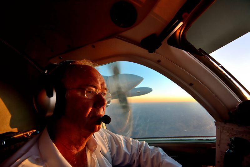 091613-2 Mike Laver contemplates sunrise aloft in Alaska